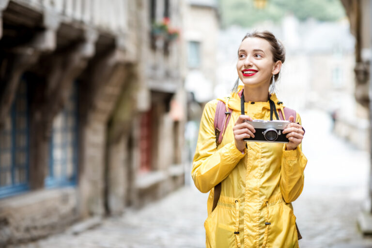 woman-traveling-in-french-town-dinan-